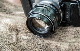 camera on wooden background photo