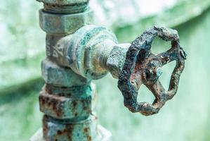 rusty and old water faucet photo