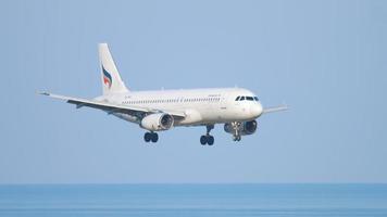 Airbus 320 approaching over ocean video