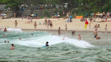 Vacationers in the waves on Phuket, Thailand video