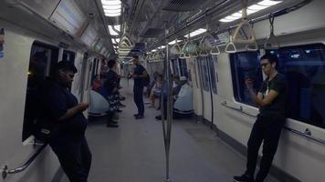 Passengers in a subway train in Singapore video