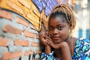 Portrait of young Black skin girls with Afro hairstyle outdoor posing. photo