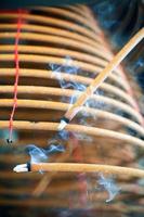 Burned coil swirl incense in Macau Macao temple, traditional Chinese cultural customs to worship god, close up, lifestyle. photo