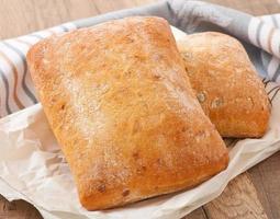 ciabatta with cheese on a wooden table photo