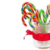 Christmas candy canes on white background photo