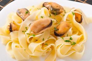 pasta with shrimps and tomatoes photo