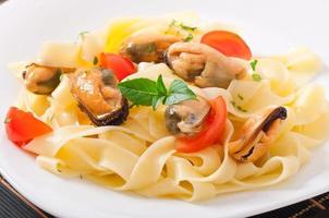 pasta with shrimps and tomatoes photo