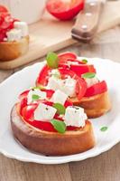 bruschetta with tomato, feta and basil photo