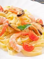 pasta with shrimps and tomatoes photo