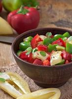 salad of sweet colorful peppers with olive oil photo