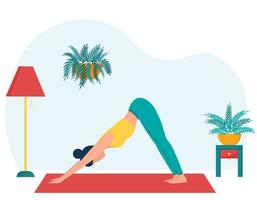 The girl practices yoga at home. The concept of yoga classes at home. A woman in the dog pose with her face down. Practice yoga in the living room. Female character on the background of home furniture
