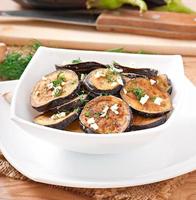 Platter of grilled eggplant with garlic and dill photo