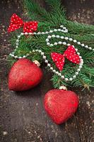Christmas decorations and fir branches on the old wooden background photo