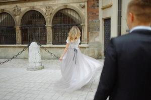 Two lovers walk along Krakow photo