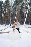 Beautiful wedding couple on their winter wedding photo