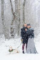 Winter walk in a snowstorm with a dog photo
