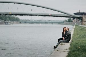 couple hugging on a pier photo