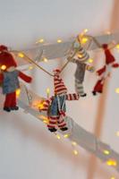 Christmas toys with garlands on the wooden garden photo