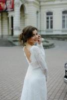 wedding couple with wedding car photo