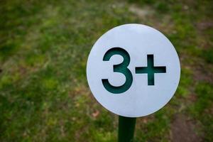 Age limit warning sign on the playground. photo