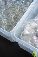 Sorting glass containers and plastic bottles for recycling and reuse. photo
