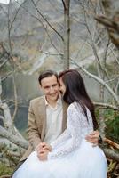 Loving couple on the background of the Sea-eye lake in Poland photo