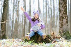 Little girl with a rabbit photo