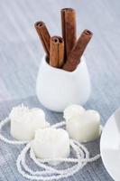 heart-shaped chocolates with candies in coconut flakes of beads photo