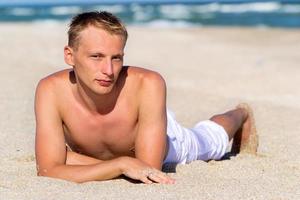 A young man by the sea photo