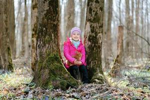 Little girl with a rabbit photo