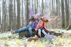 Little girls in the forest photo