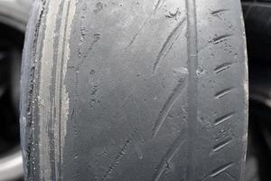 Old black car tires. Unauthorized dump. photo