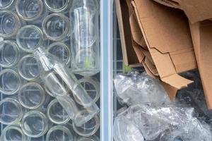 Plastic bottles, glass and cardboard are sorted for recycling. photo