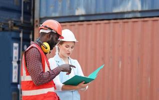 foreman checking containers in the terminal, at import and export business logistic company. photo