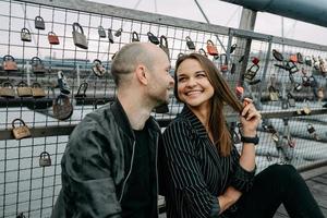 Young romantic couple on river embankment photo