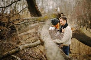 Hug in the autumn park under a tree photo