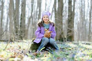 Little girl with a rabbit photo