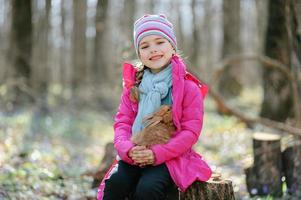 Little girl with a rabbit photo