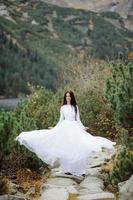 Bride near the Sea-eye lake in Poland photo