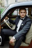 Handsome man in the car, businessman photo