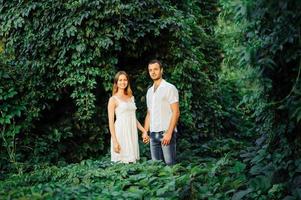 happy couple have fun in the park on nature. photo