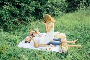 happy couple have fun in the park on nature. photo