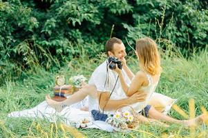 happy couple have fun in the park on nature. photo