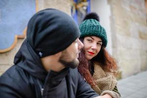 Cheerful young couple having fun in winter park photo