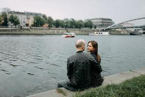 couple hugging on a pier photo