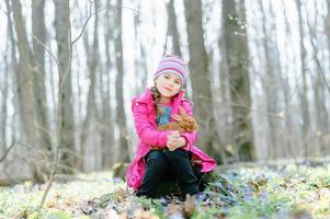 Little girl with a rabbit photo