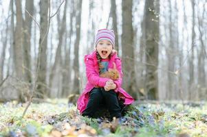 Little girl with a rabbit photo