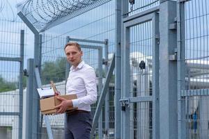 A businessman released from prison ponders what to do next. photo