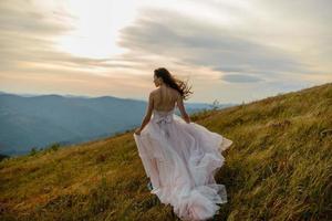 Bride in the mountains. The concept of lifestyle and wedding. photo