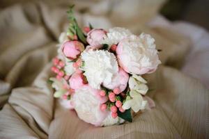 Bridal bouquet on the green grass. photo